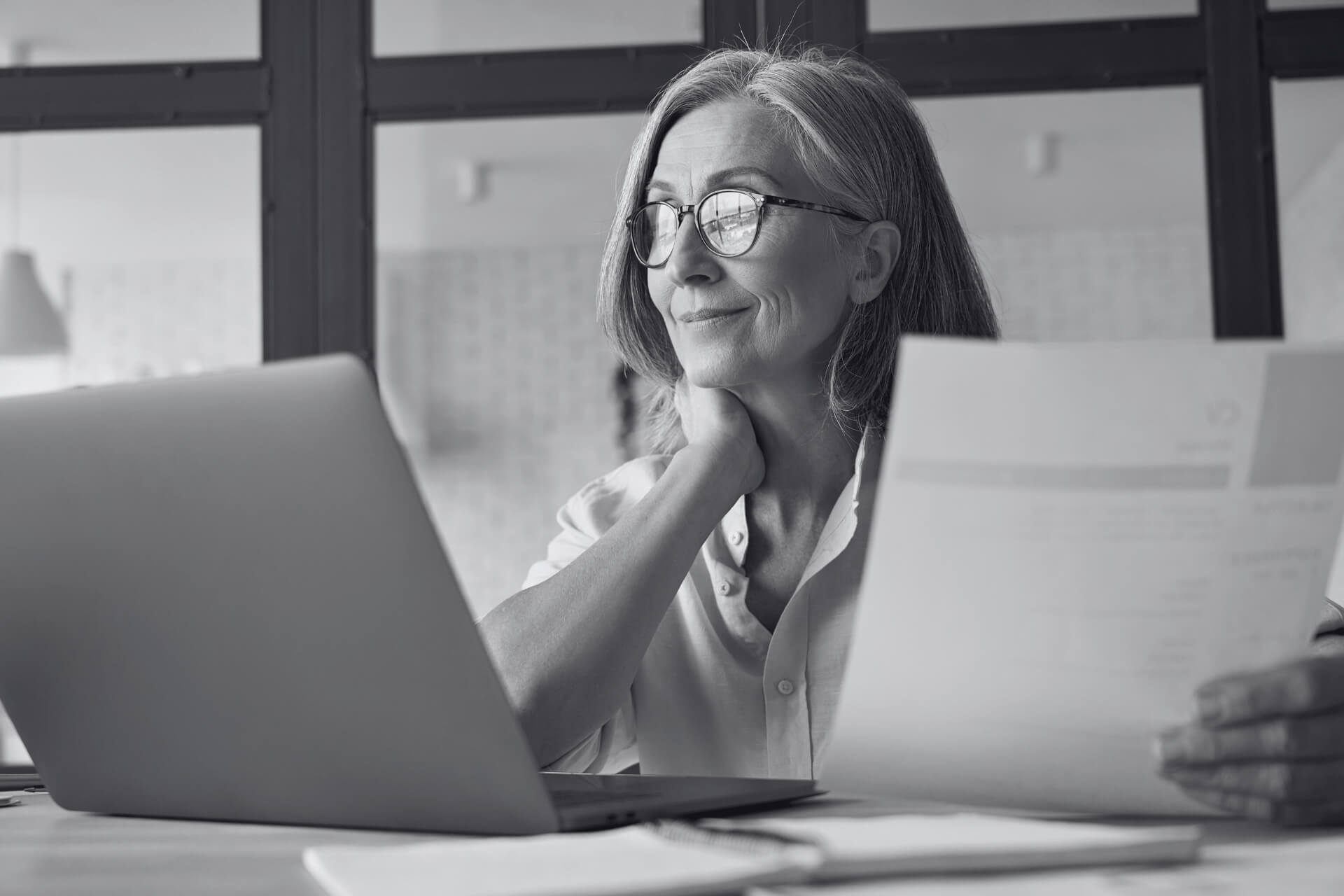 property manager at desk in front of computer